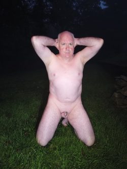 Faggot Henry Loftus kneeling naked outside with his tiny clit locked in chastity.