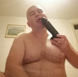 Faggot sucks a dildo